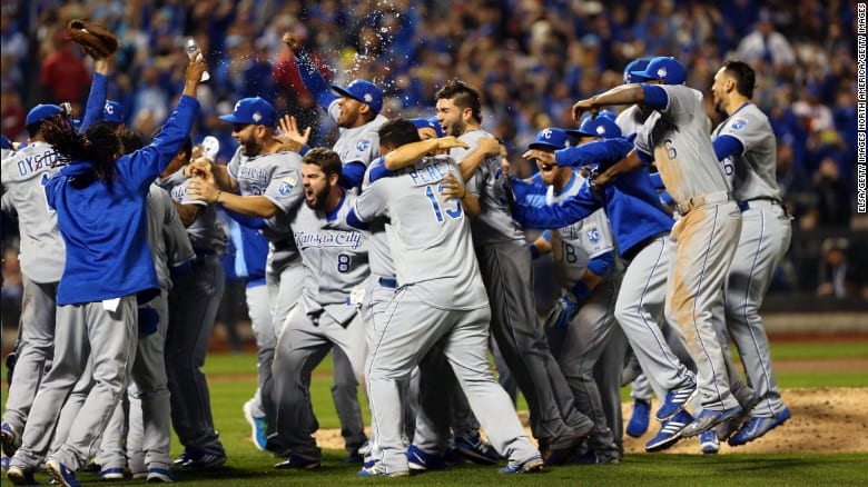 Kansas City Royals celebrating and throwing water on the field